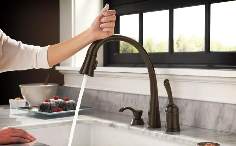 Touch activated kitchen faucet