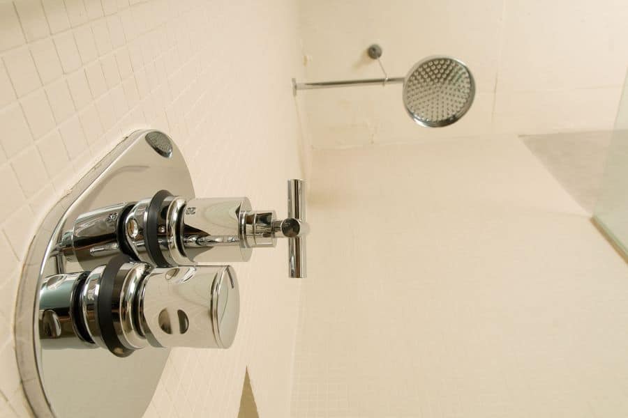 Low angle view of shower fixture in bathroom