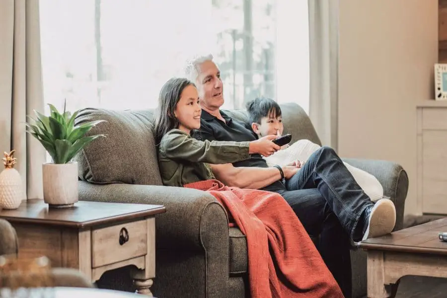 Family sitting on a Flexsteel sofa