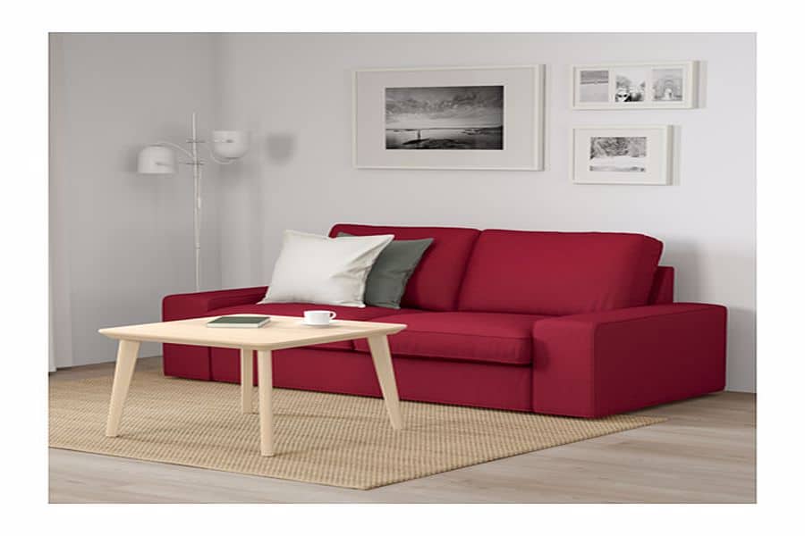 Red sofa with throw pillows