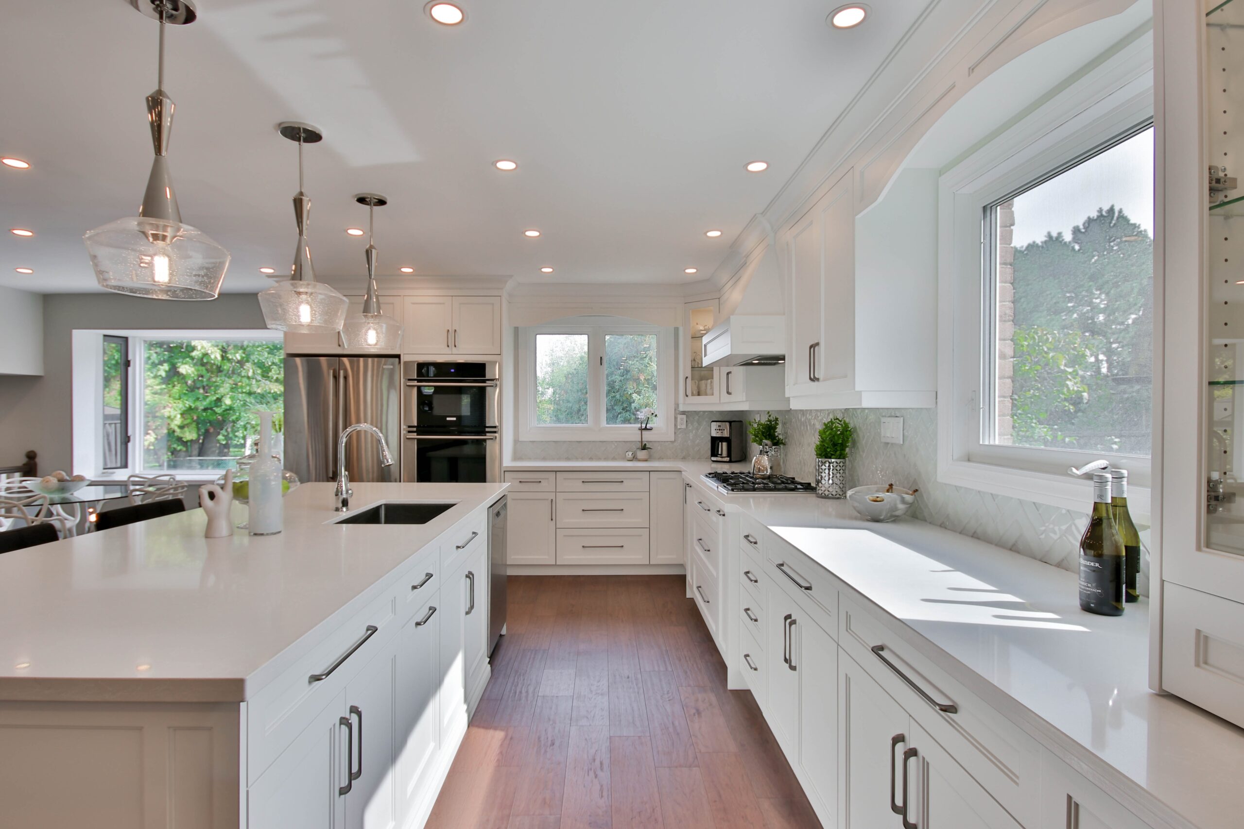 kitchen area with white toned cabinets near window - Brookhaven Cabinet Reviews