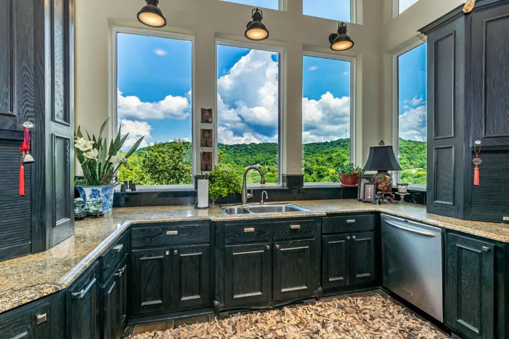 black toned cabinets near window - Brookhaven Cabinet Reviews