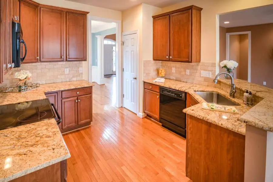 Kitchen with Aristokraft cabinets and granite countertops