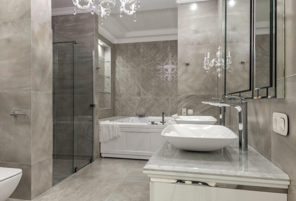 Vanity bathroom with mirrors and glass door