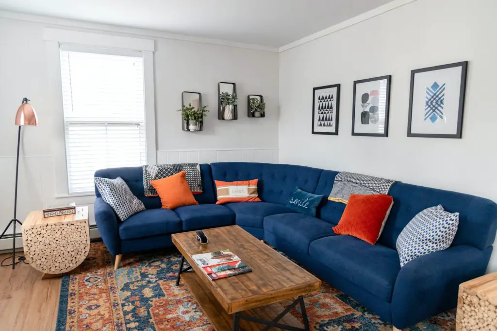 Blue toned sofa in the living room with a table