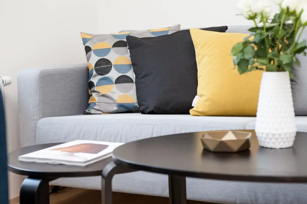 Gray sofa with three pillows