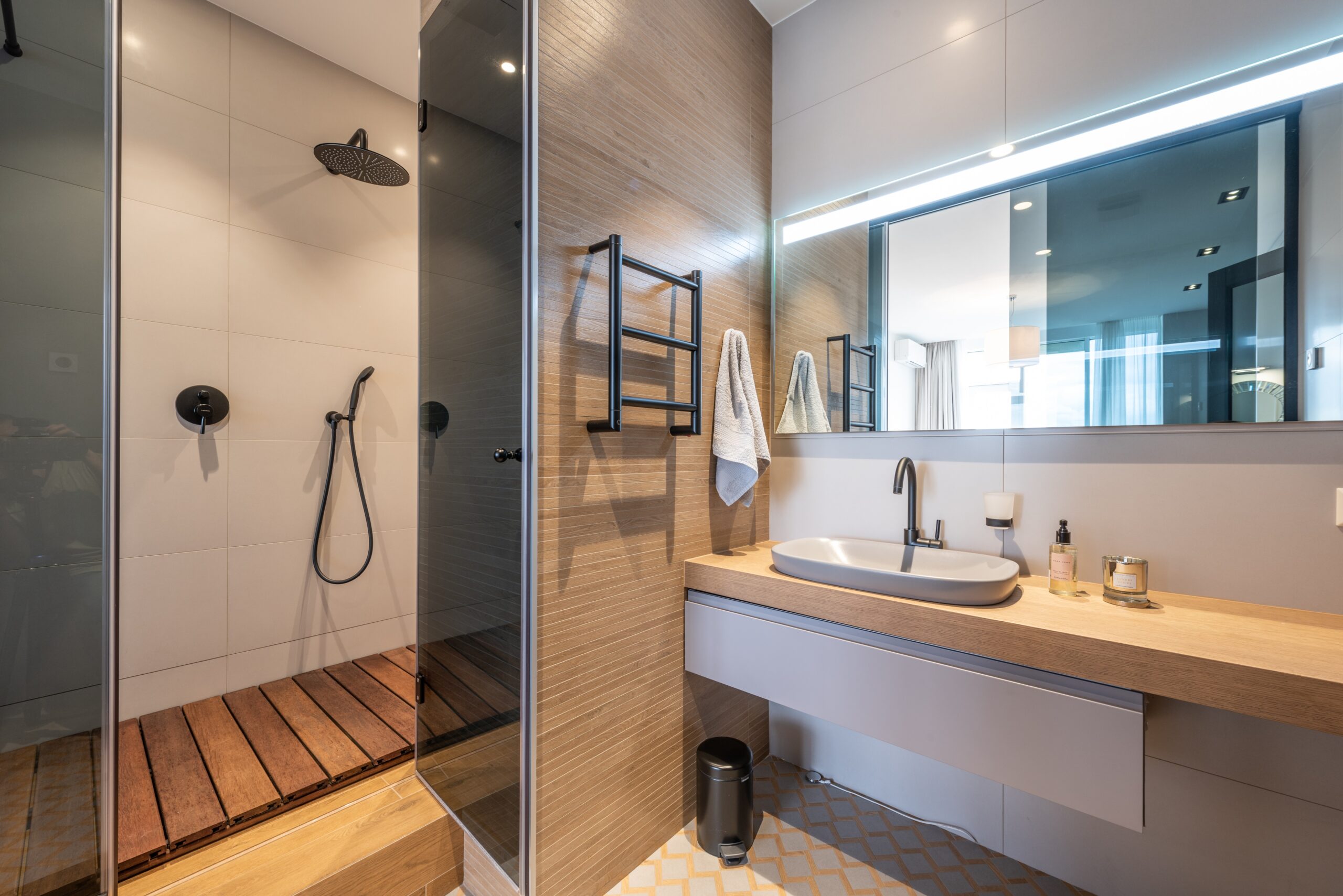 Vanity bathroom with shower and mirror