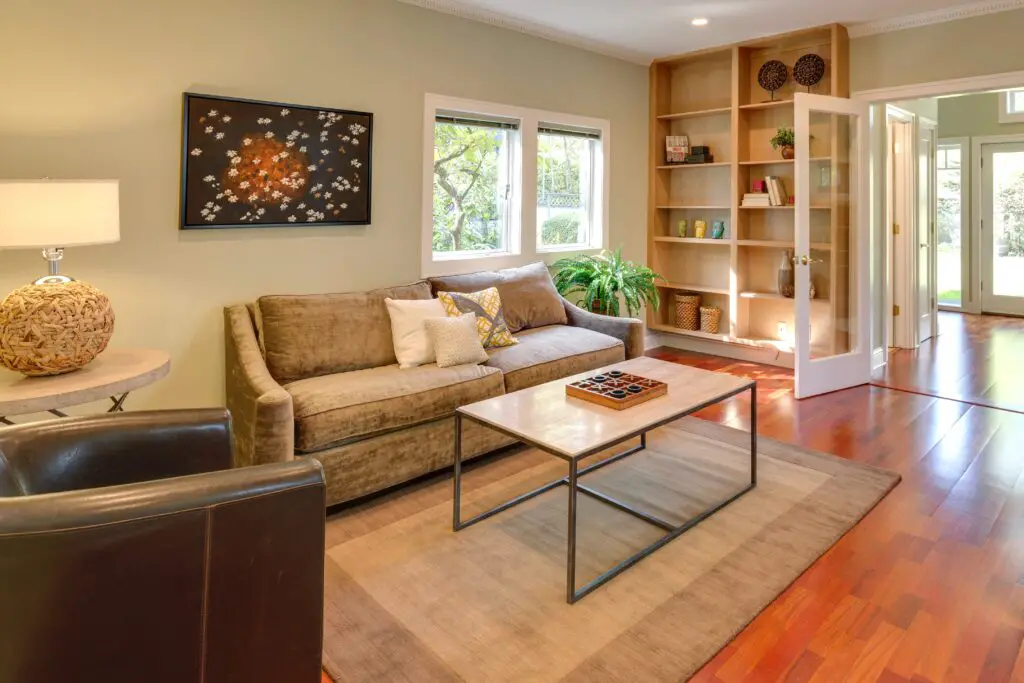 A living room with furniture near the window