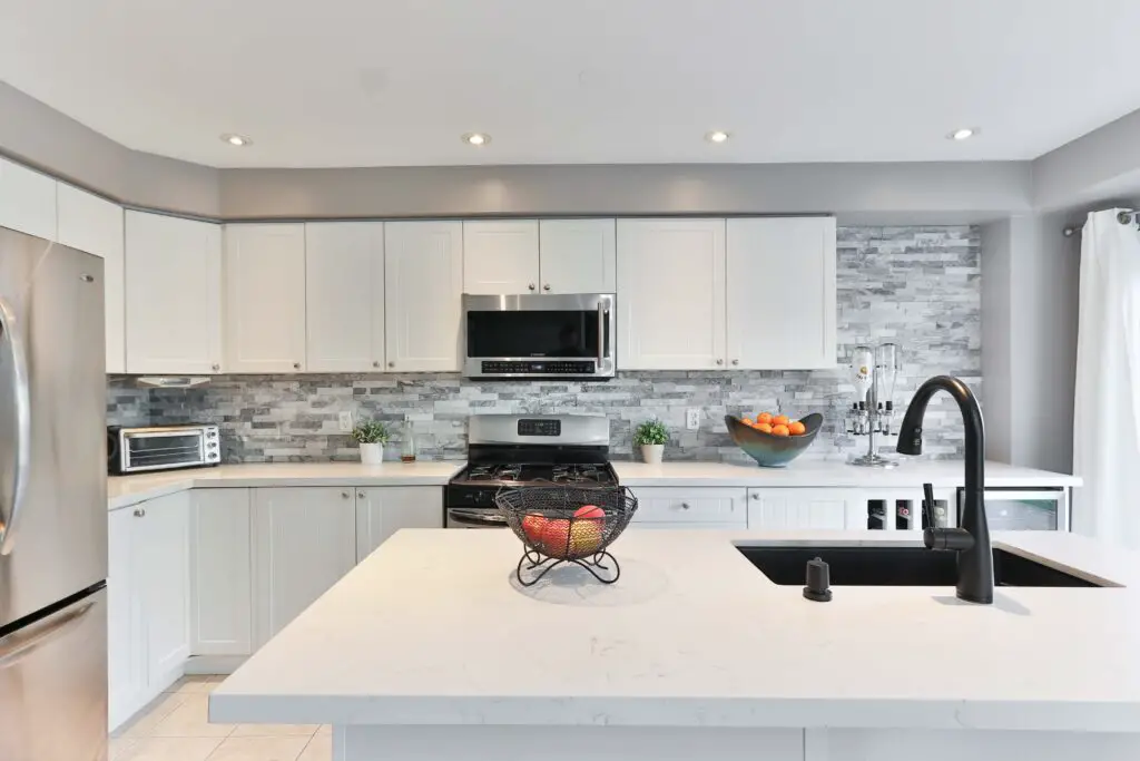 A white toned kitchen area 