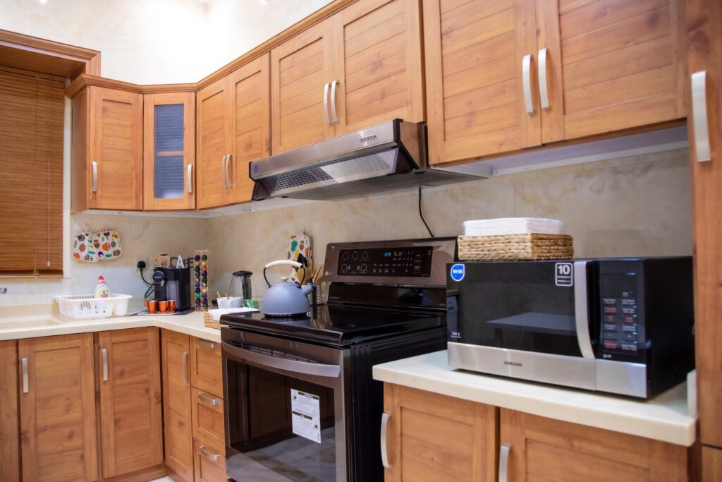 Kitchen area with appliances and wooden cabinets