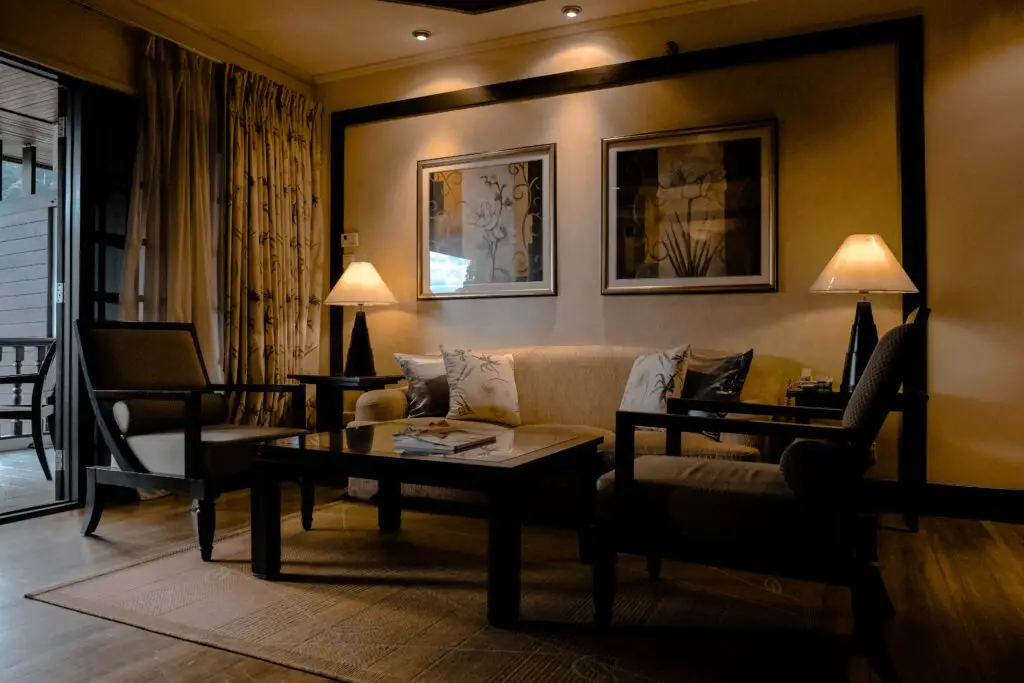 Living room with black toned furniture and lamps