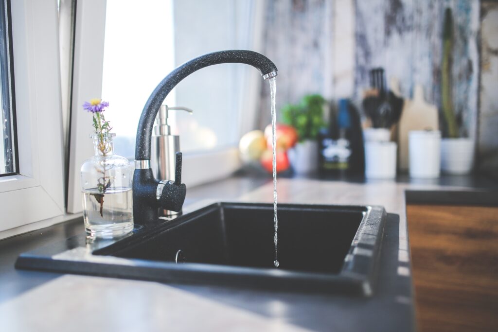 a black sink with a black faucet