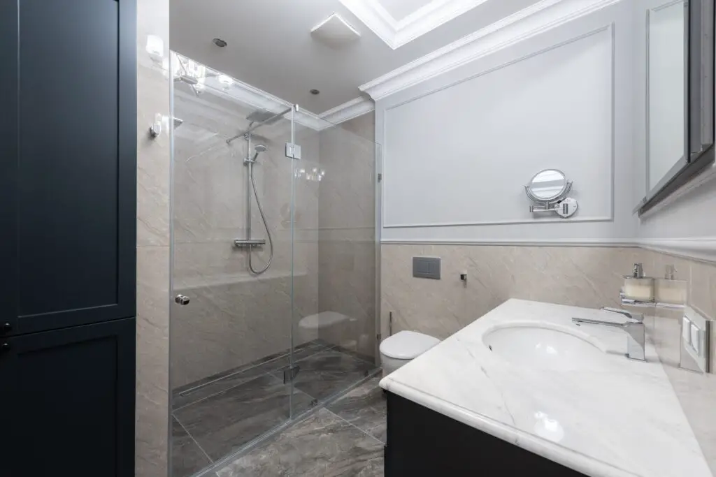 A bathroom with shower near the sink