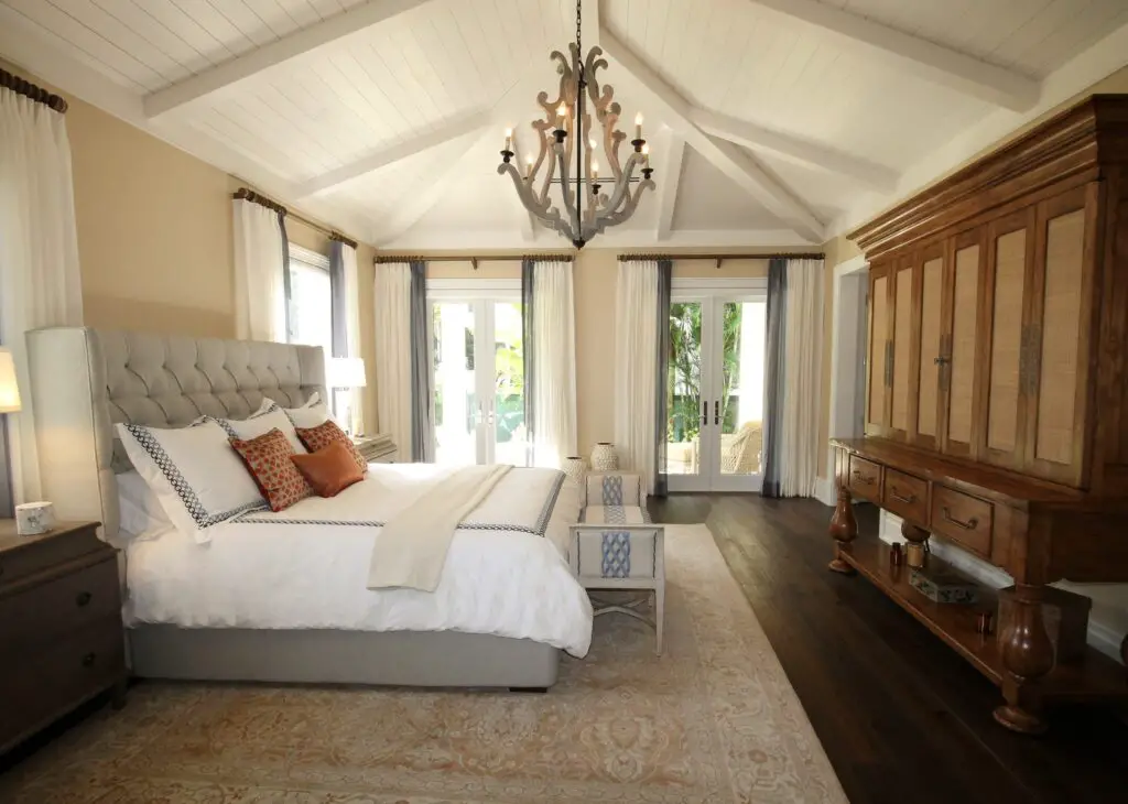 A bedroom with an accented cabinet