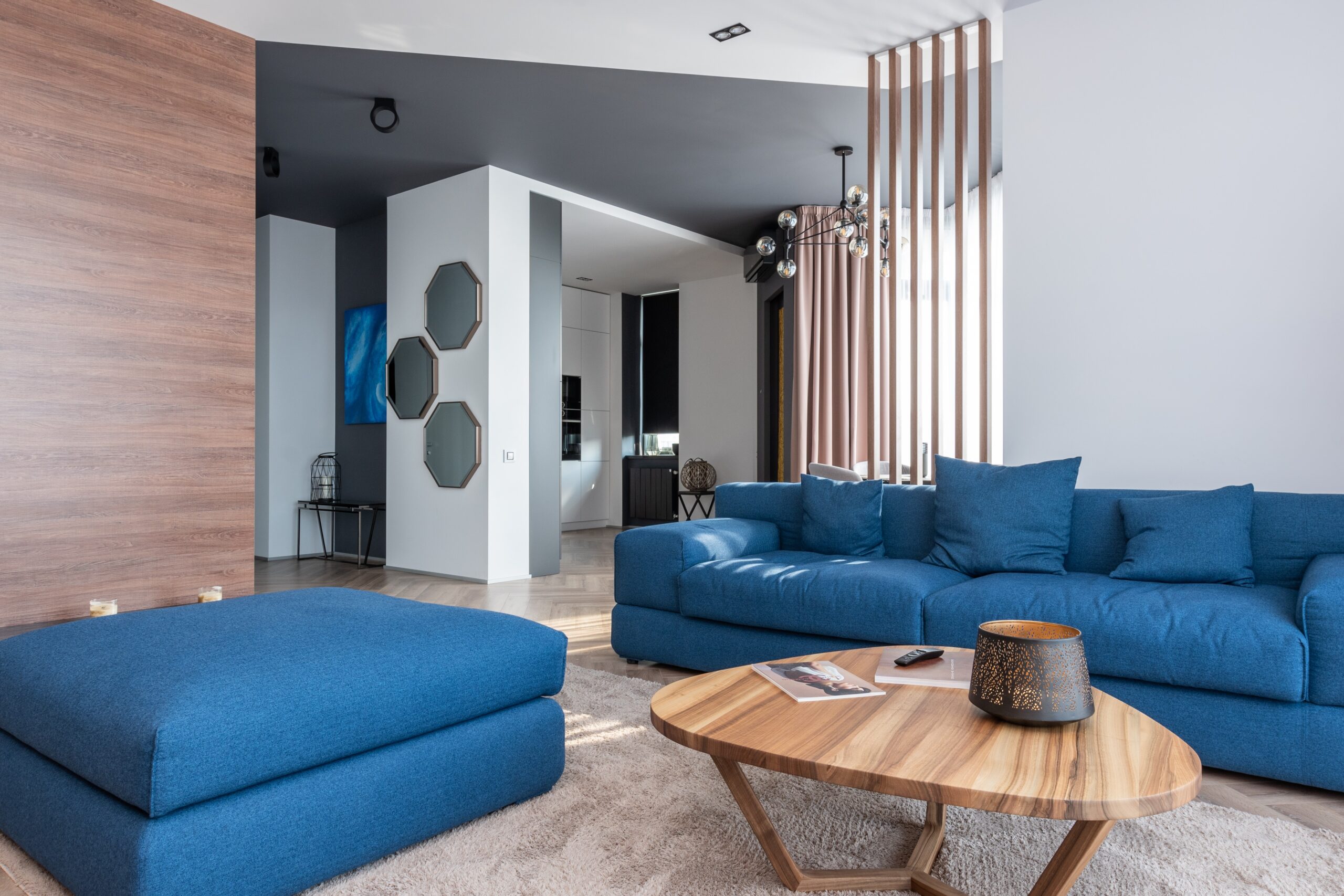 A blue colored sofa in the living room