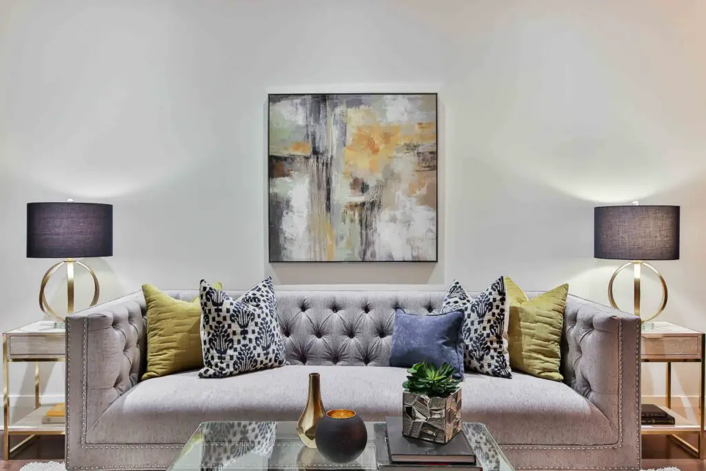 A gray sofa and a painting