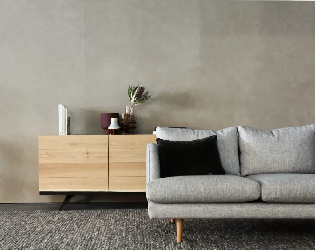 A gray sofa and a cabinet