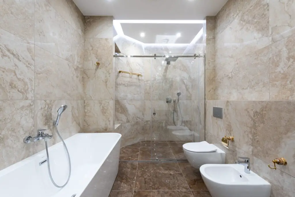 A bathroom with shower and bathtub