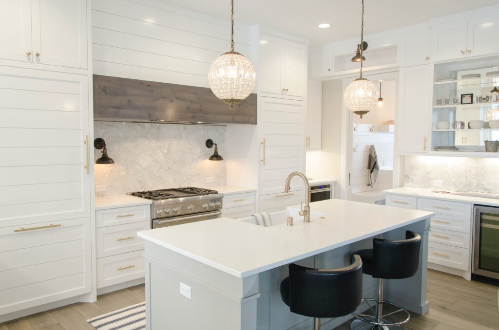 A white toned kitchen and dining area
