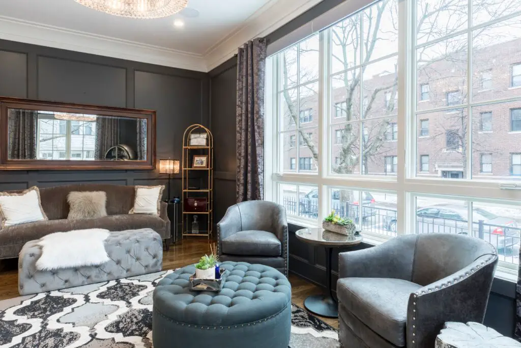 Gray toned furniture near the window 