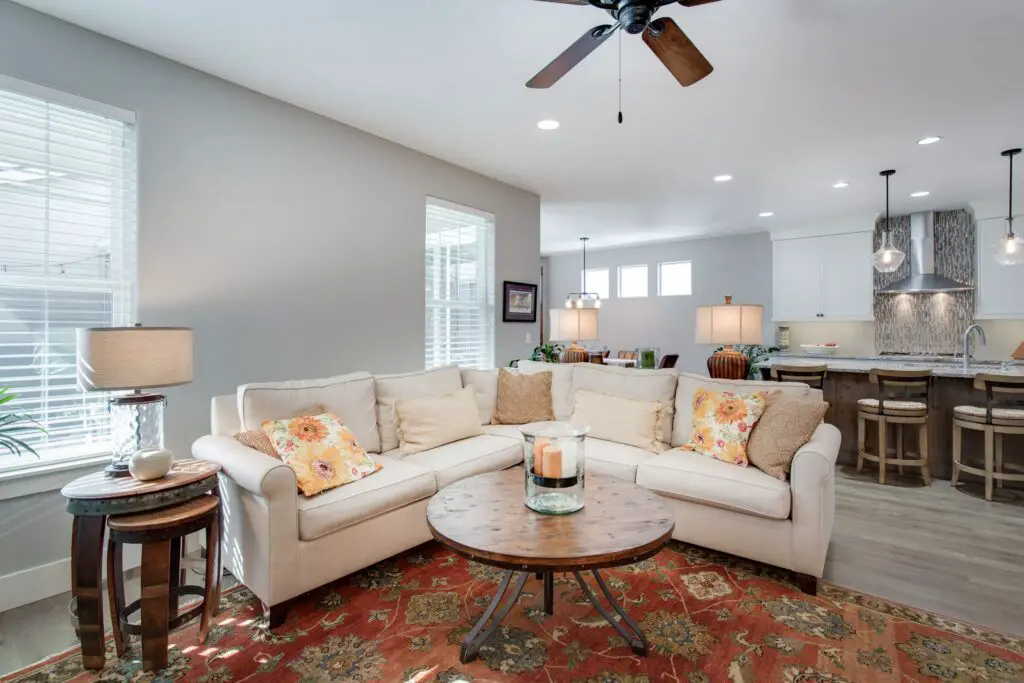A living room interior design with a sectional sofa