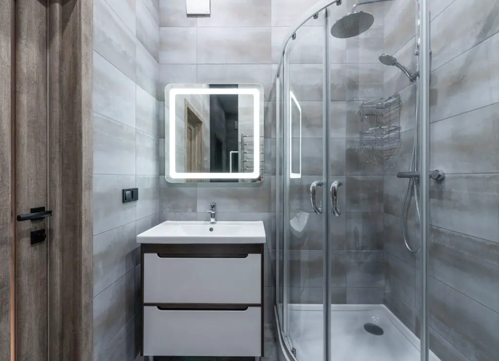 A bathroom with a shower enclosure