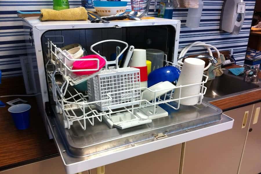 An image of a dishwasher full of dishes