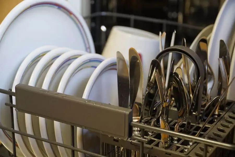 Plates and utensils in an overnight dishwasher