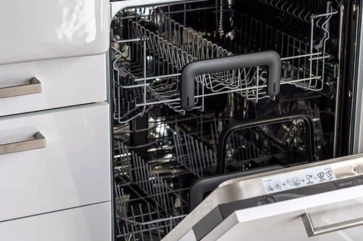 Stainless steel dishwasher with two racks each with silver handles are opened for use