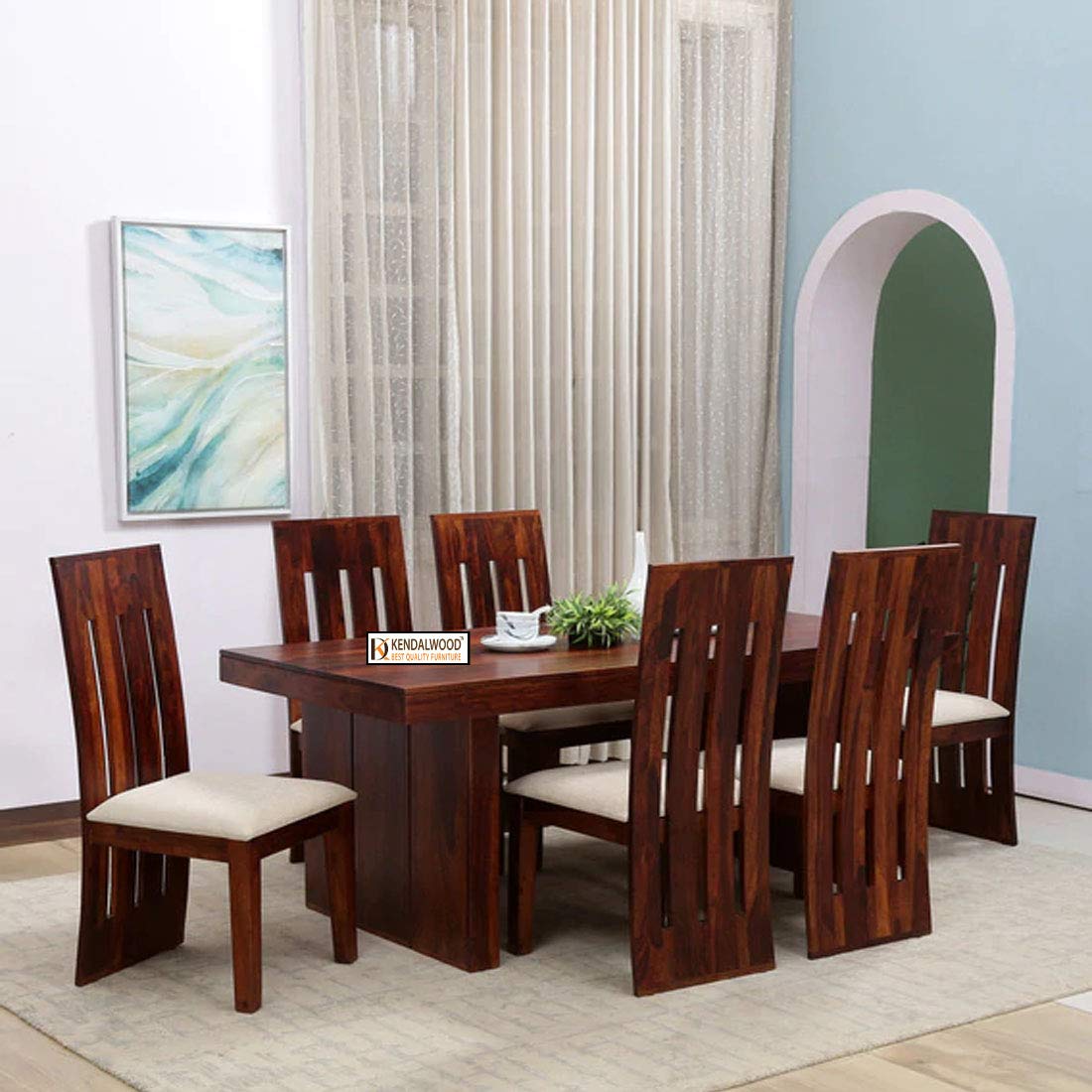 A brown wooden dining table with six brown chairs from Kendalwood Furniture