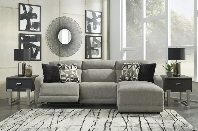 A gray power reclining sectional sofa set with throw pillows from Prime Furniture