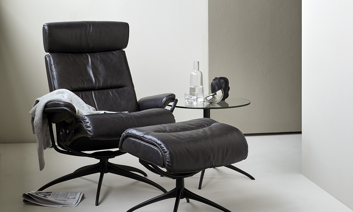 A leather recliner from Stressless furniture with black leather foot rest