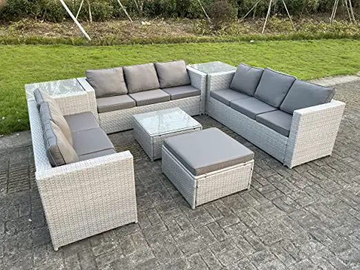 A light gray sofa set with a corner table and footstool placed outdoor